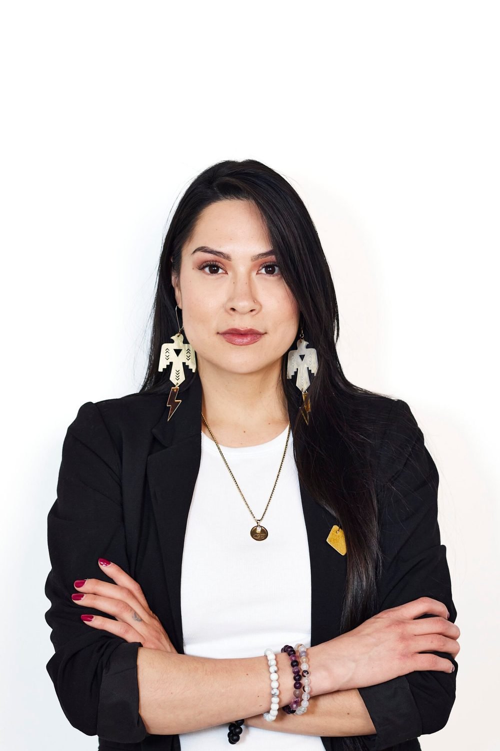 Eagle Medicine founder portrait in a black blazer