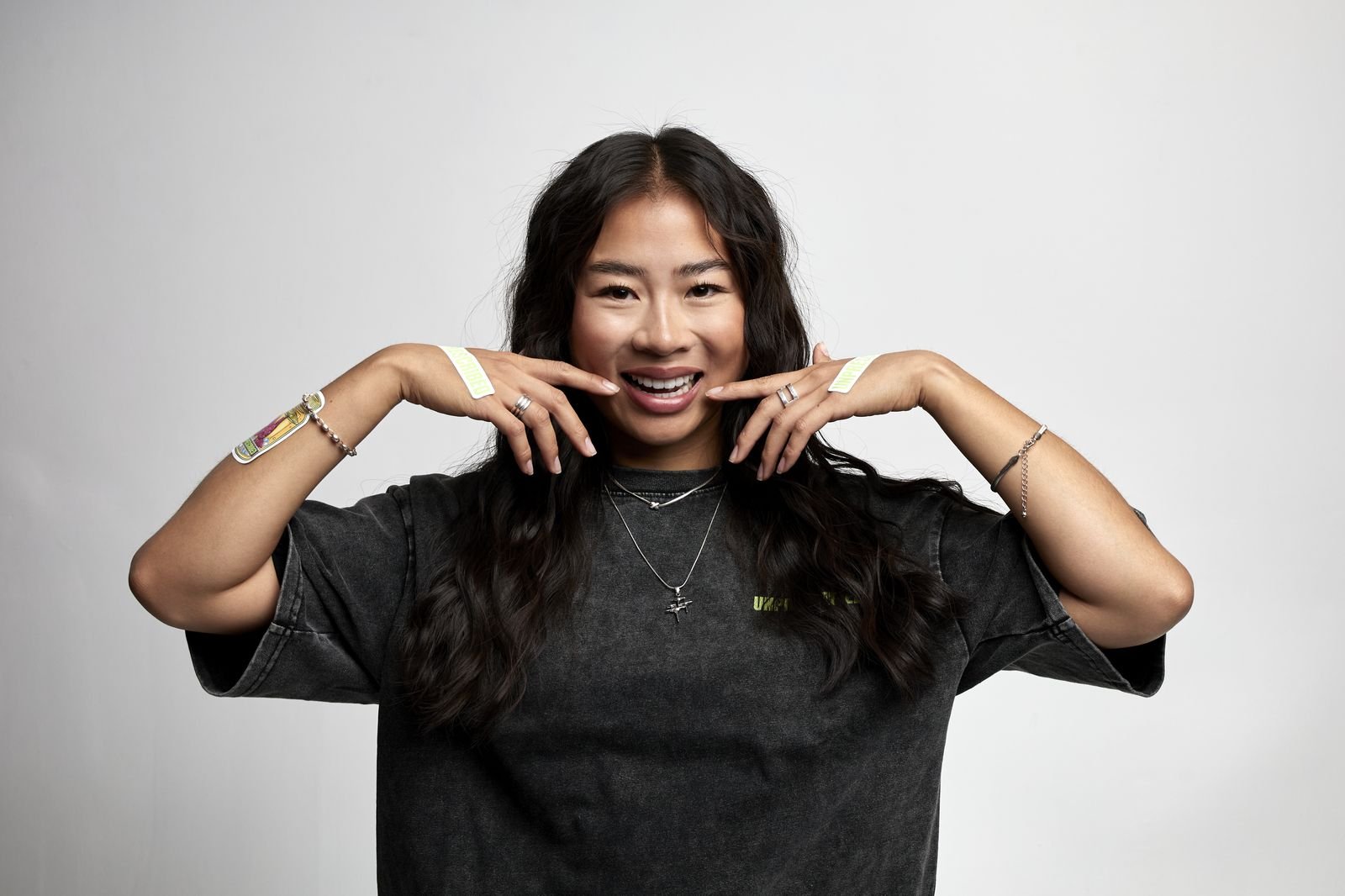 Model pulling a wide smile in an Unprescribed tee