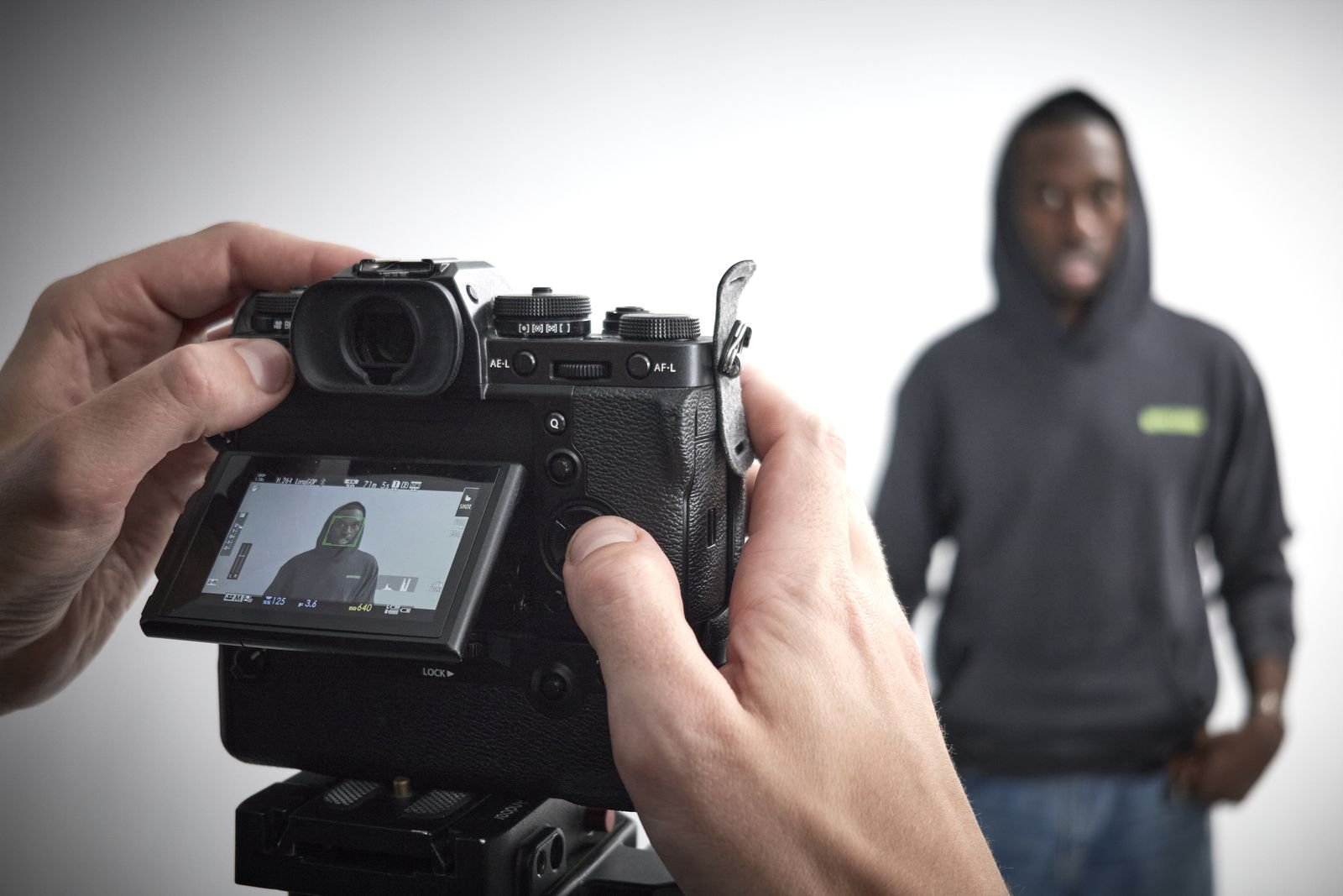 Camera screen framing a model during the shoot